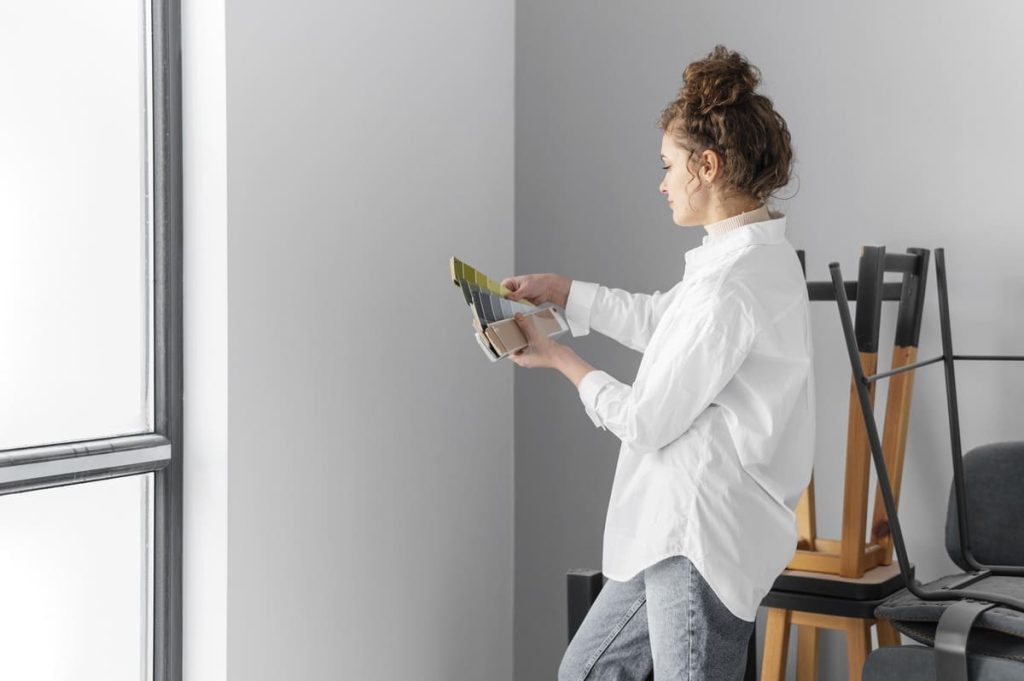 Woman choosing the ideal paint color